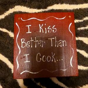 Red Wooden Sign with Humorous Quote